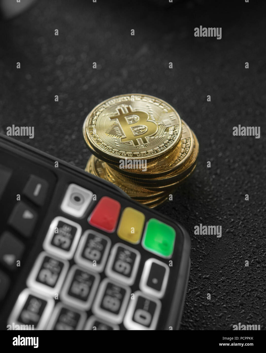 A pile of gold Bitcoin coins and POS terminal. Bitcoins Cryptocurrency.  E-commerce, business, finance concept, banking and paymant Stock Photo -  Alamy