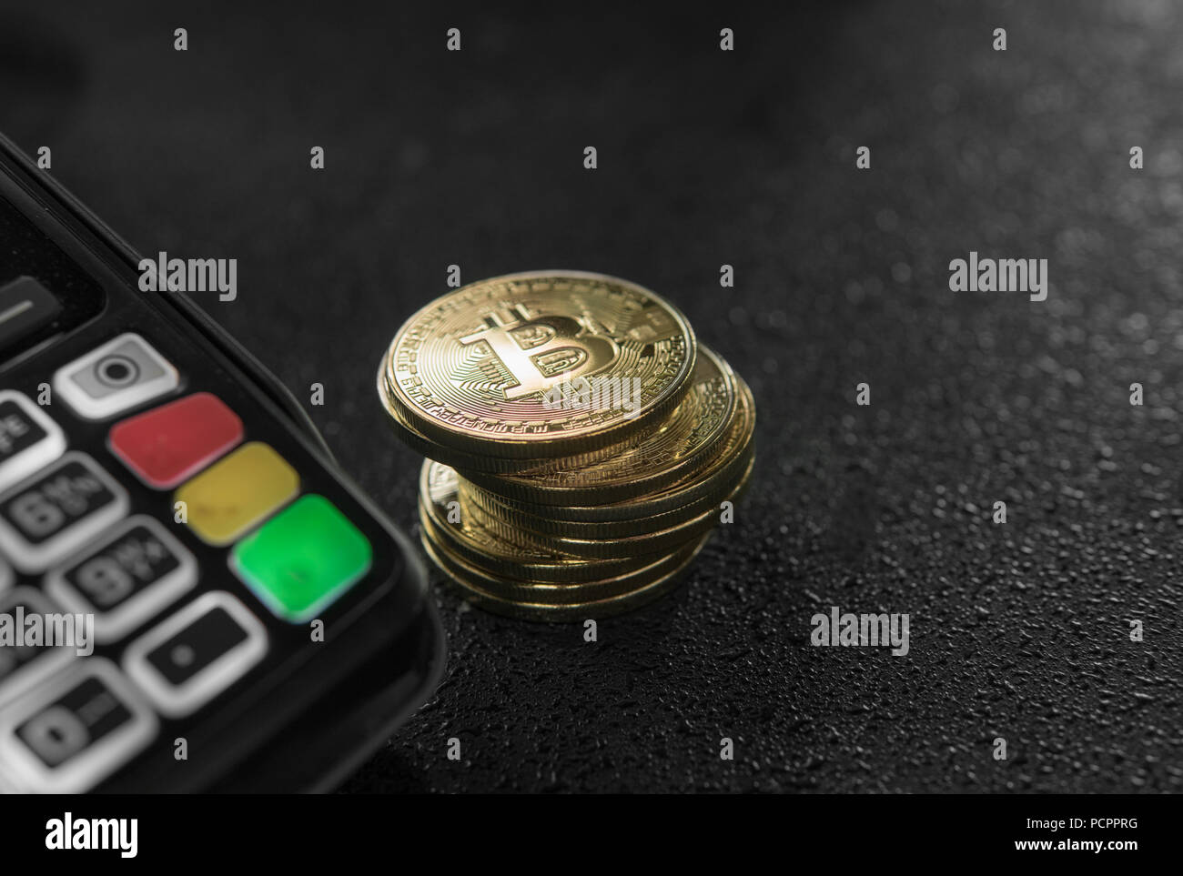 A pile of gold Bitcoin coins and POS terminal. Bitcoins Cryptocurrency.  E-commerce, business, finance concept, banking and paymant Stock Photo -  Alamy