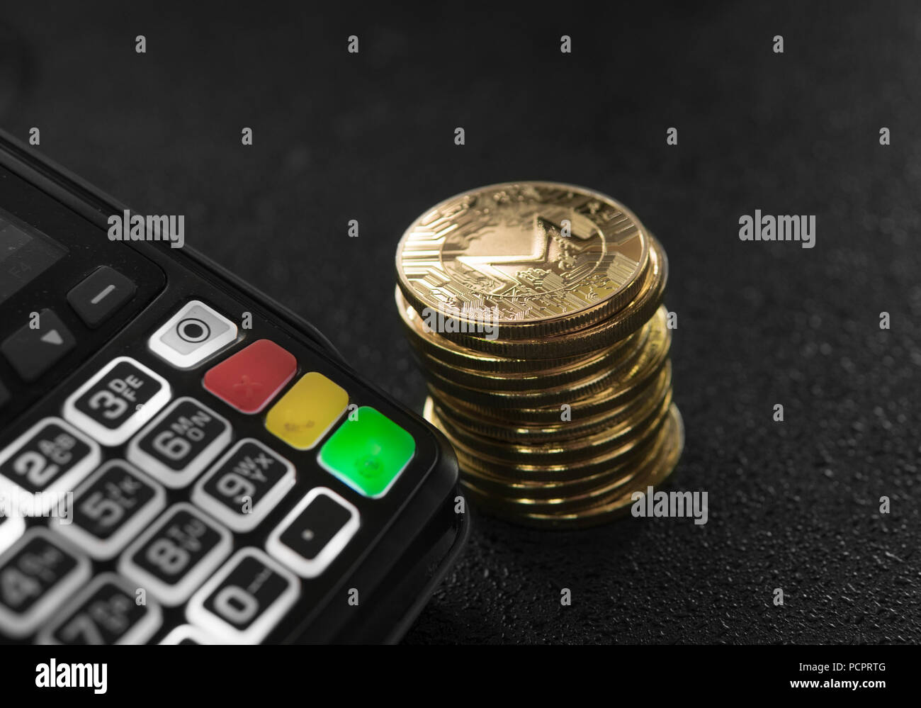 A pile of gold Monero Crypto currency coins and POS terminal. Moneros  Cryptocurrency. E-commerce, business, finance concept, banking and payment  Stock Photo - Alamy