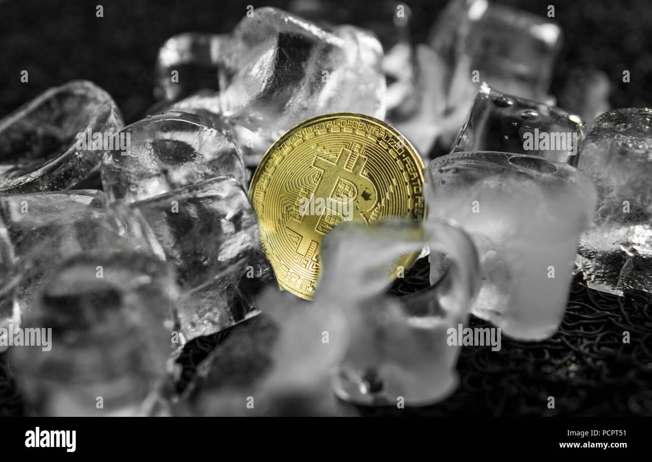 Golden coin with bitcoin symbol frozen in ice. Freezing of cryptocurrency,  depreciation, legal and economic problems of the cryptocurrency market them  Stock Photo - Alamy