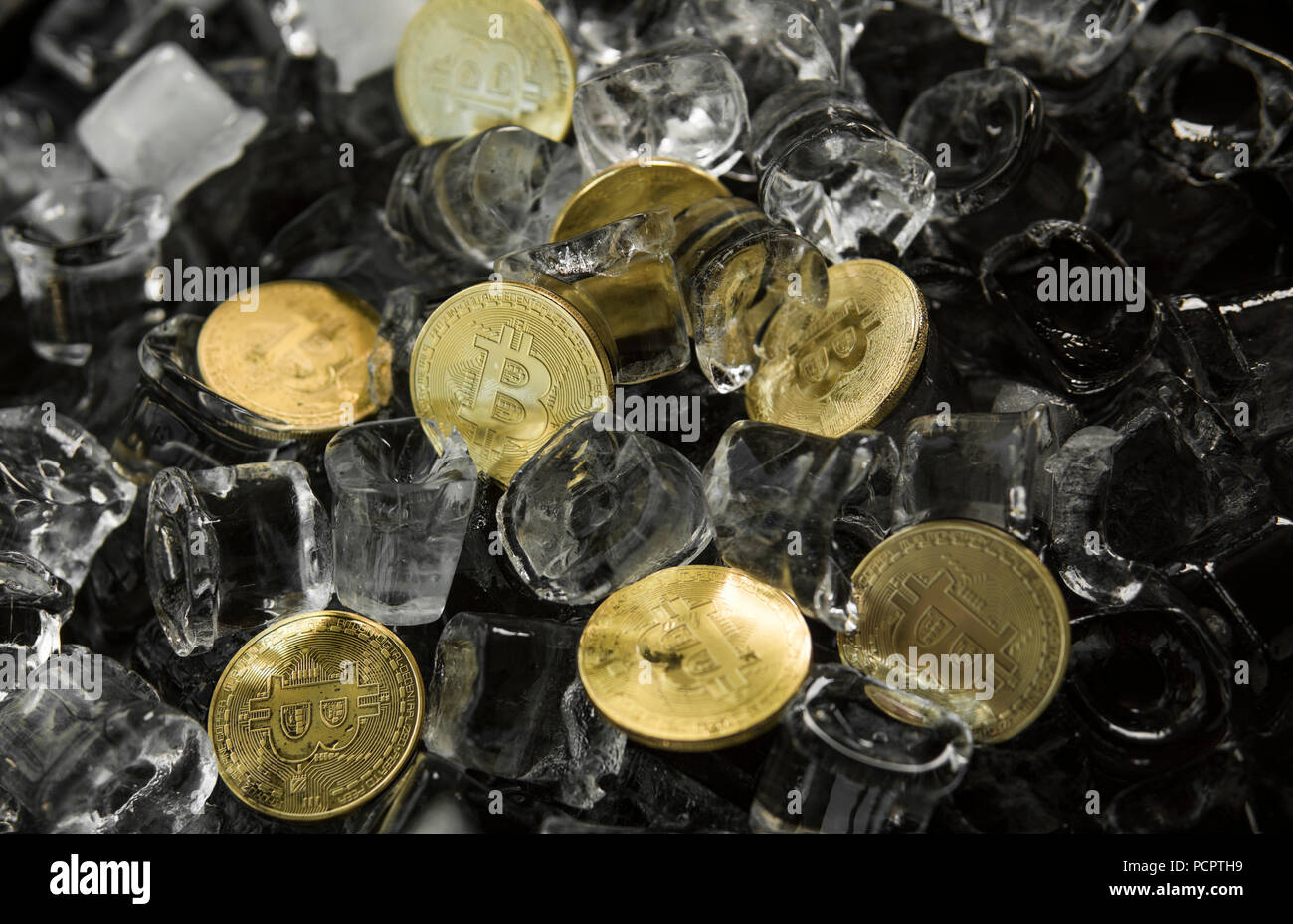 Golden Bitcoin Coin On Frozen Ice Stock Photo - Alamy