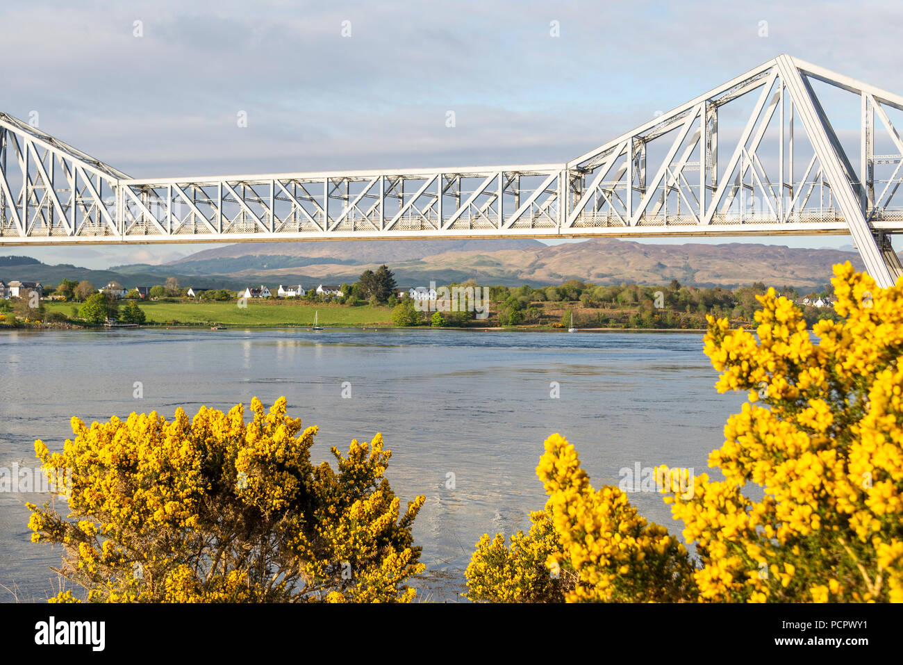 sunset over the Connel bridge and Lora waterfall Stock Photo