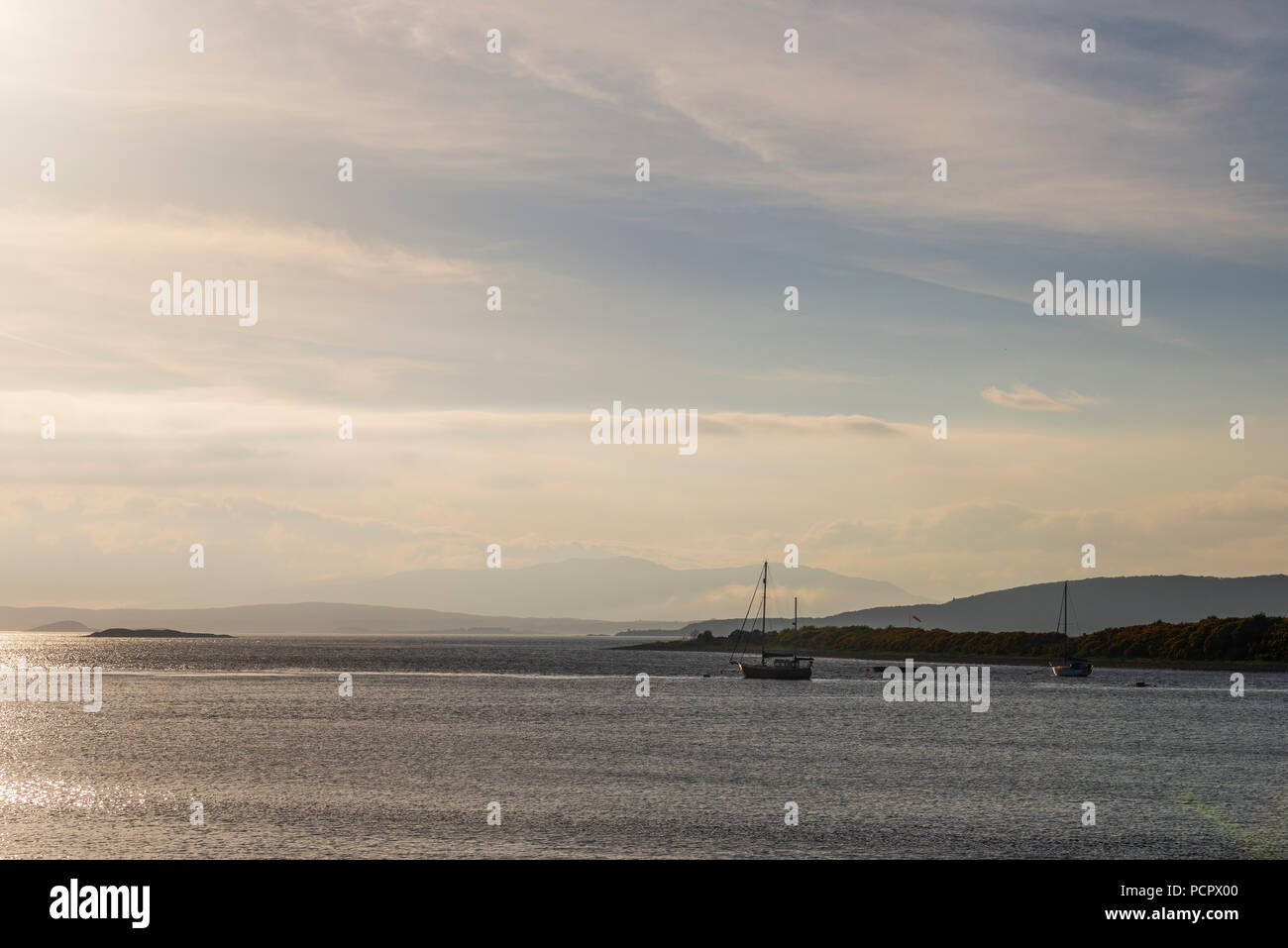 sunset over the Connel bridge and Lora waterfall Stock Photo