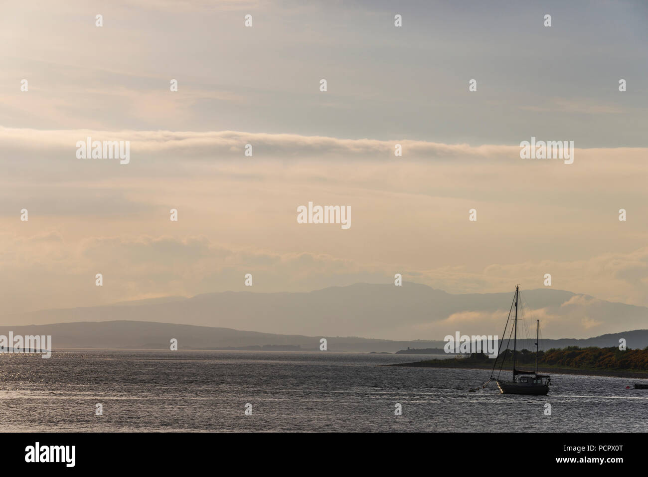 sunset over the Connel bridge and Lora waterfall Stock Photo