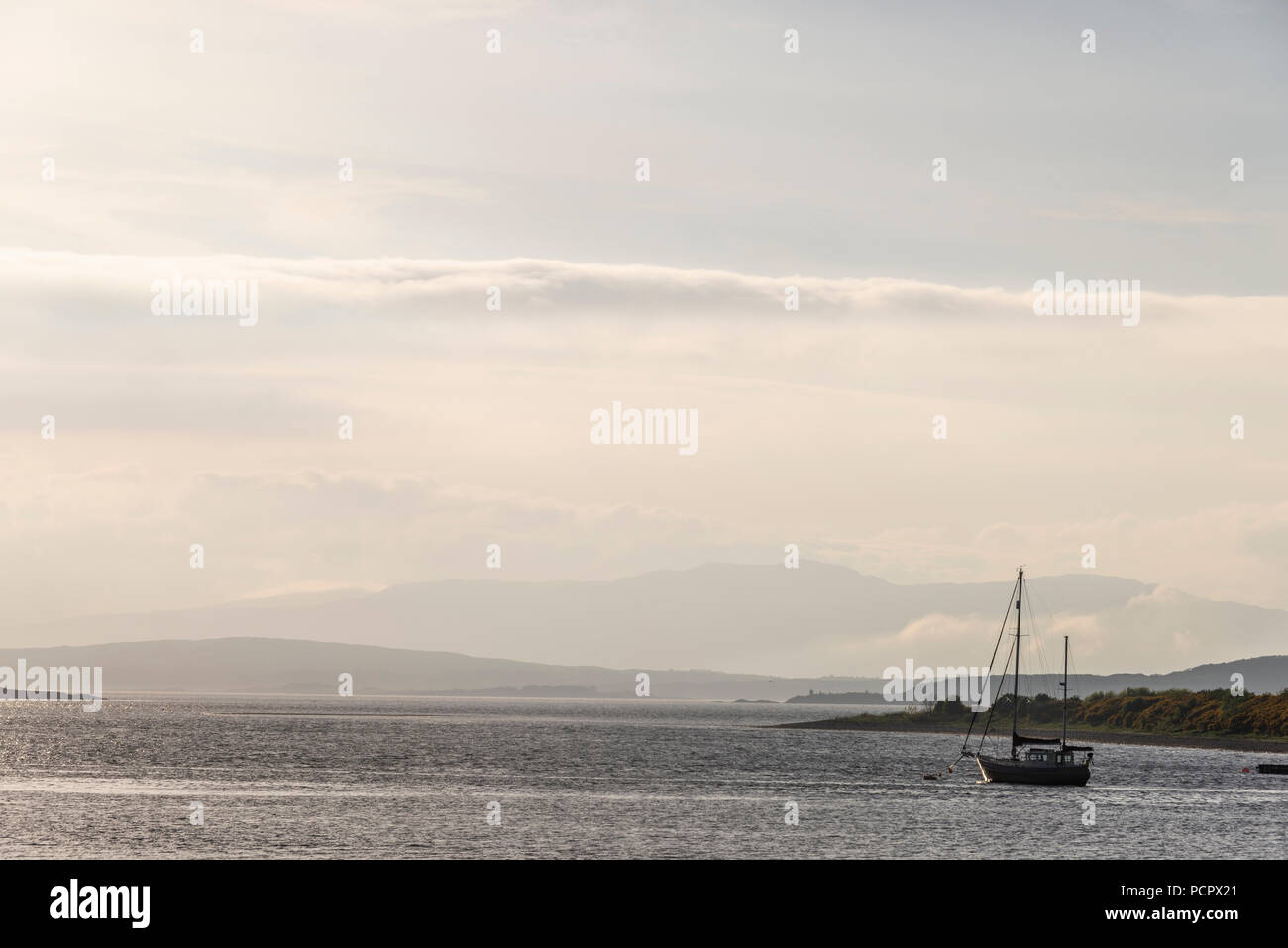 sunset over the Connel bridge and Lora waterfall Stock Photo