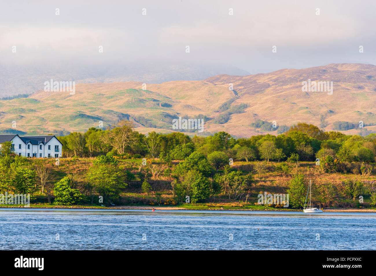 sunset over the Connel bridge and Lora waterfall Stock Photo
