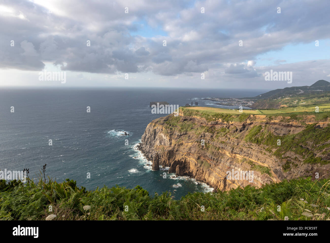 Rocky cliff from Miradouro da Ponta do Escalvado, Varzea, Sao Miguel island, Azores, Portugal Rocky cliff from Miradouro da Ponta do Escalvado, Varzea, Sao Miguel island, Azores, Portugal