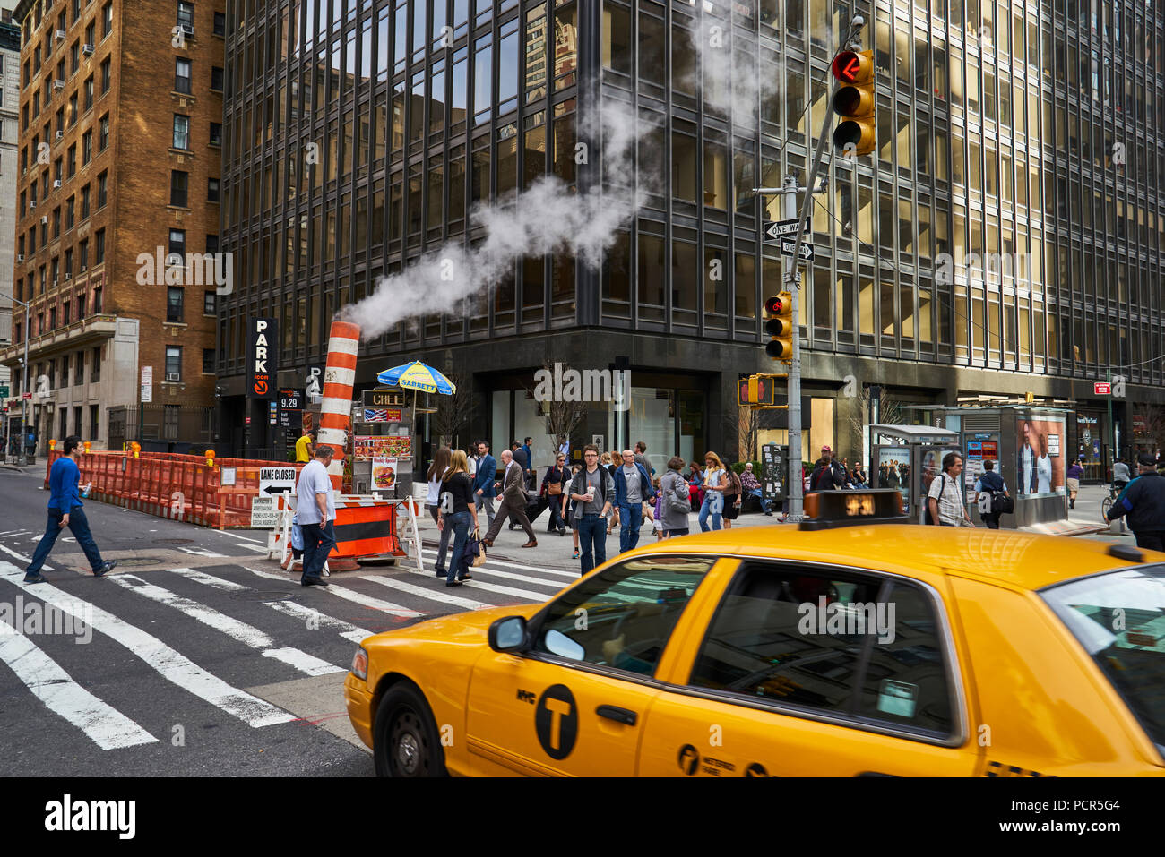 steam leak coming out a temporary chimney at a busy midtown street in Manhattan Stock Photo