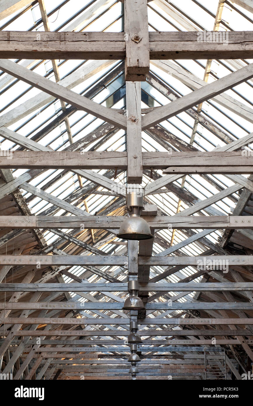 Old turning shop, interior view of the unique in Germany roof construction with wooden support on cast-iron columns Stock Photo