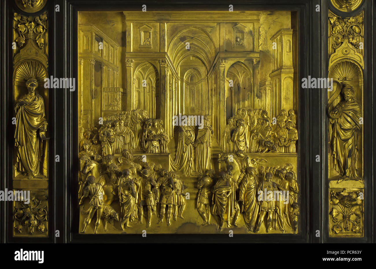 Story of King Solomon and the Queen of Sheba depicted in the gilded bronze panel from the Gates of Paradise (Porta del Paradiso) designed by Italian Early Renaissance sculptor Lorenzo Ghiberti for the Florence Baptistery (Battistero di San Giovanni), now on display in the Museo dell'Opera del Duomo (Museum of the Works of the Florence Cathedral) in Florence, Tuscany, Italy. Stock Photo
