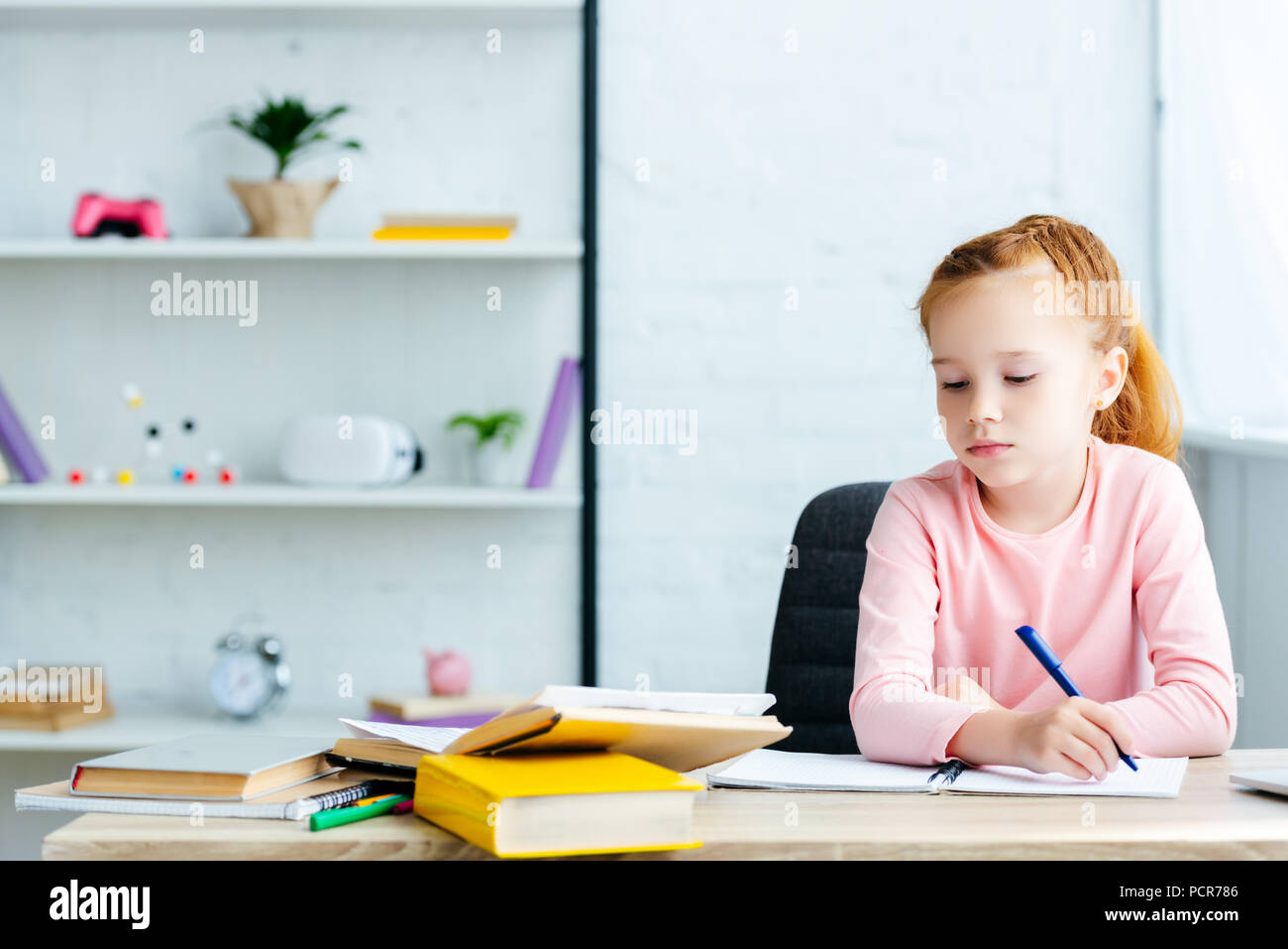 Beautiful girl sitting desk studying hi-res stock photography and ...