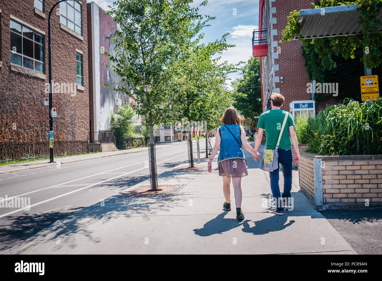 Couple holding hands walking summer hi-res stock photography and images ...