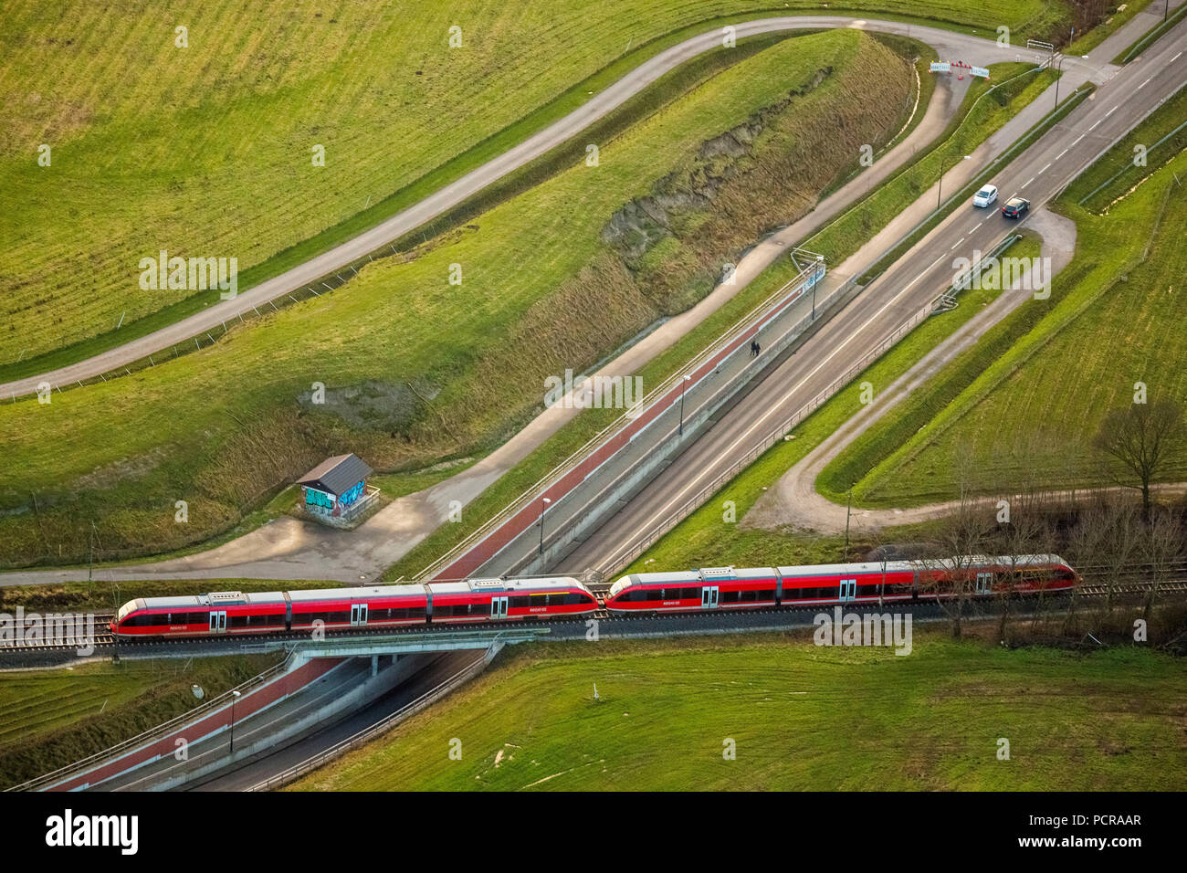 Regionalbahn, railway, regional railway crossing a car underpass, railway bridge, railway station Bockum-Hövel with environment, Hamm, Ruhr area, North Rhine-Westphalia, Germany Stock Photo