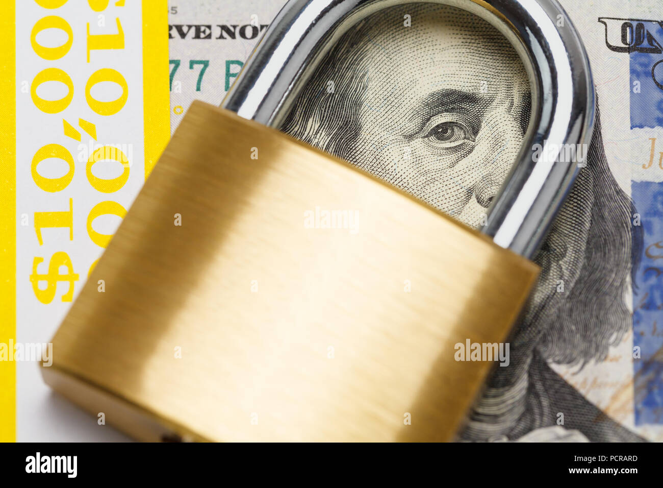 Close up of Hundred Dollar Bill with Lock. Stock Photo