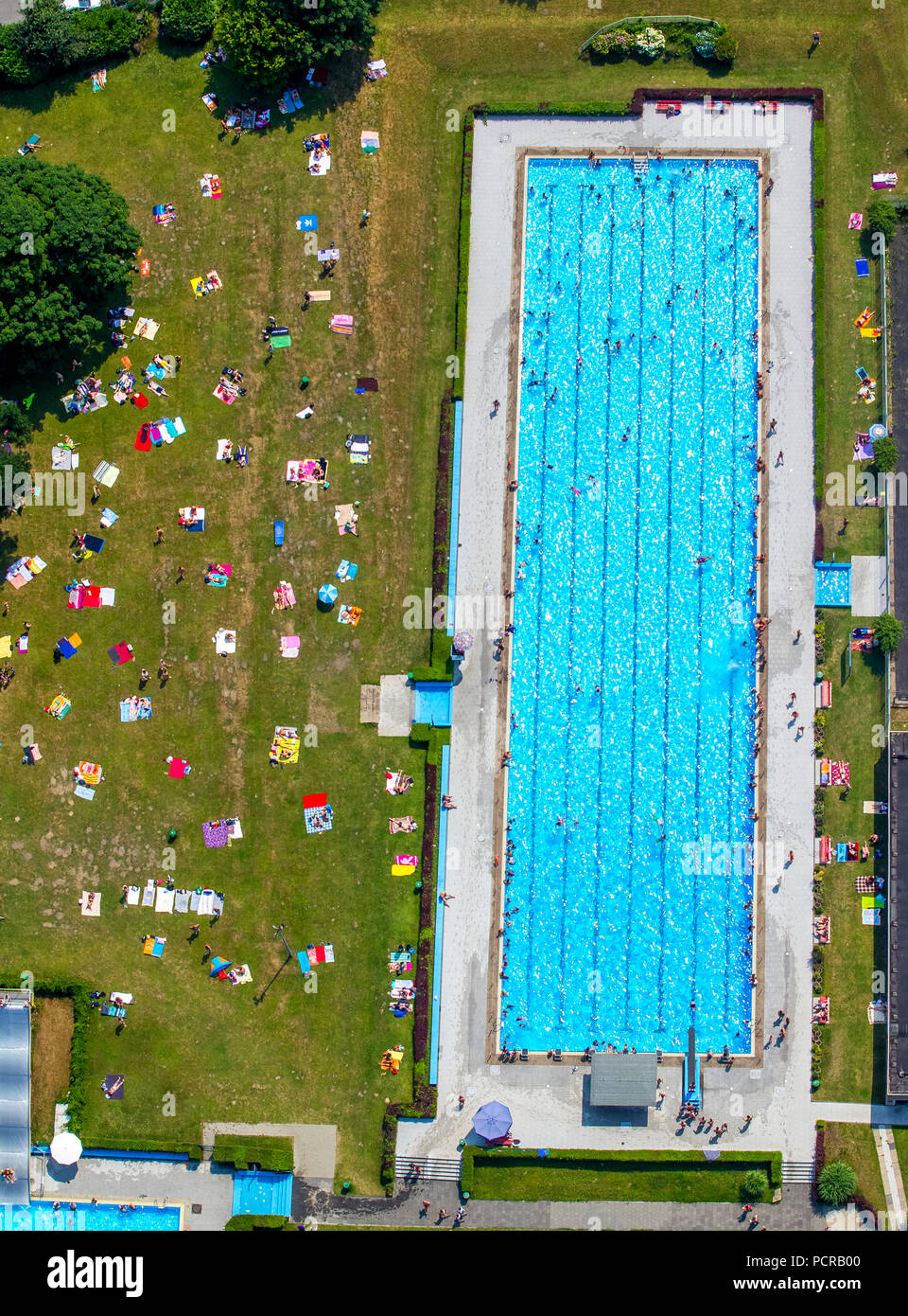 Outdoor swimming pool Werne with swimming pool, paddling pool and sunbathing area with shadow, Bochum, Ruhr area, North Rhine-Westphalia, Germany Stock Photo