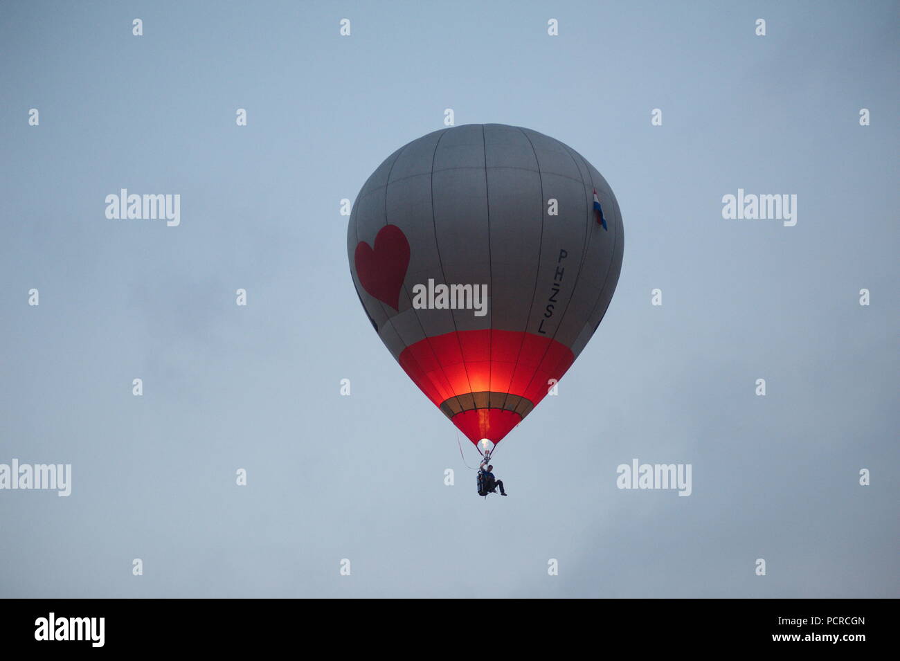colorful hot air balloons against a blue sky Stock Photo - Alamy