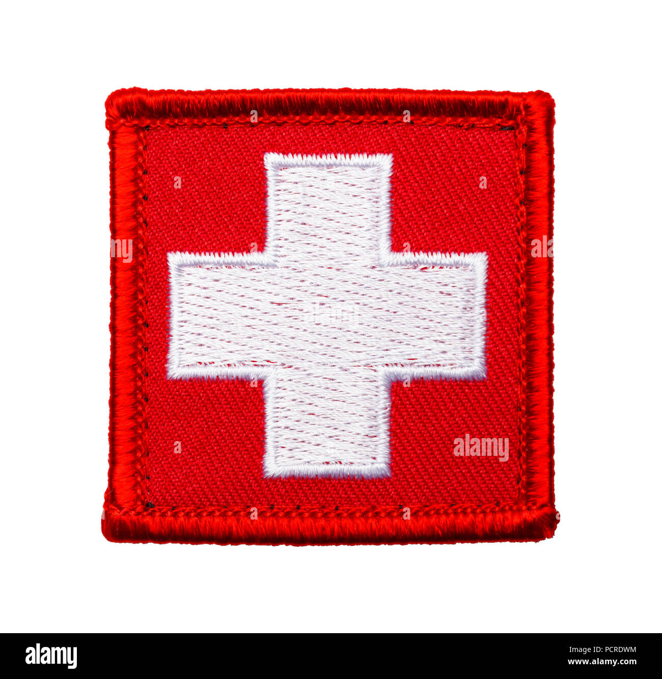 Red Medical Cross Patch Isolated on a White Background. Stock Photo