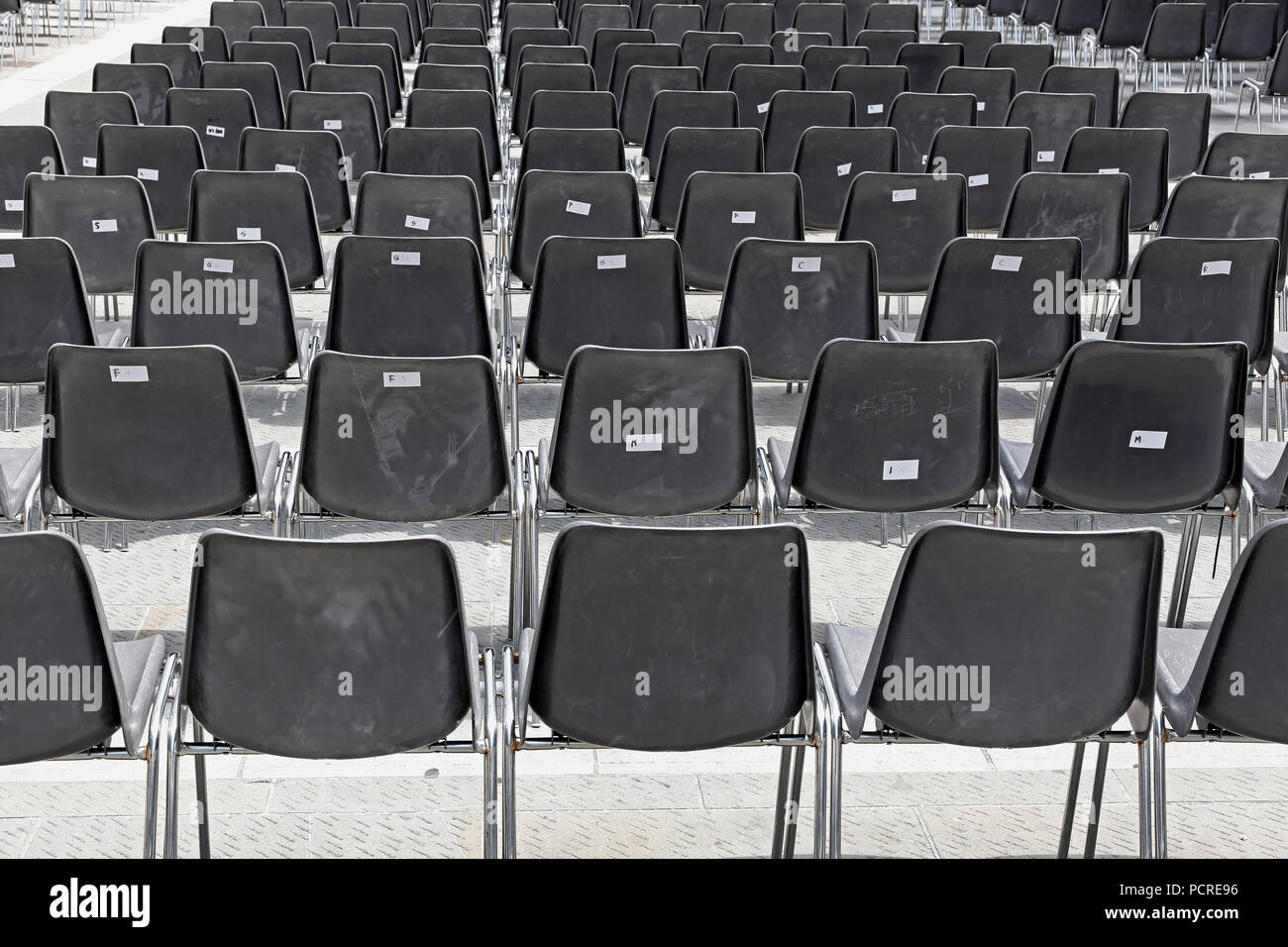 Empty gray portable plastic chairs for audience Stock Photo Alamy