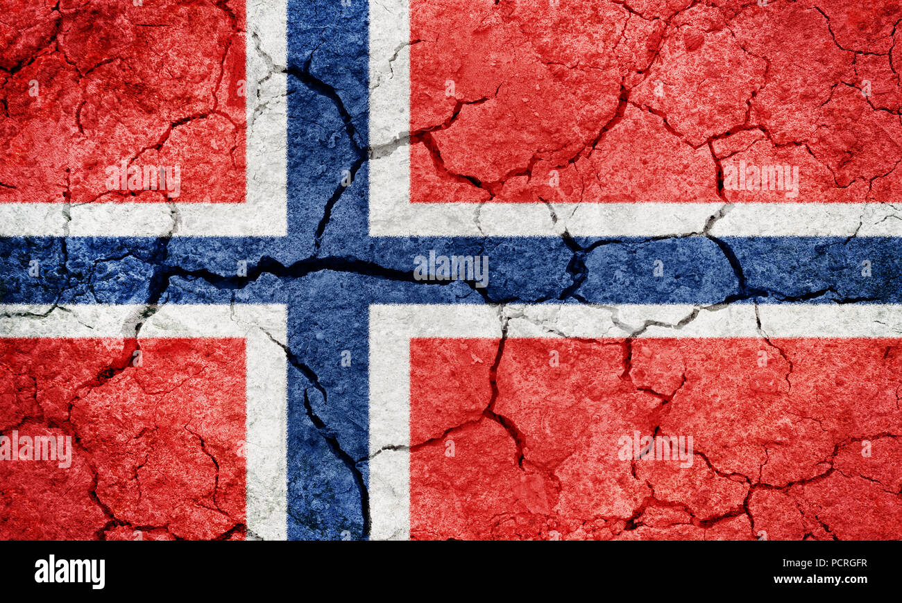 Kingdom of Norway flag on dry earth ground texture background Stock Photo