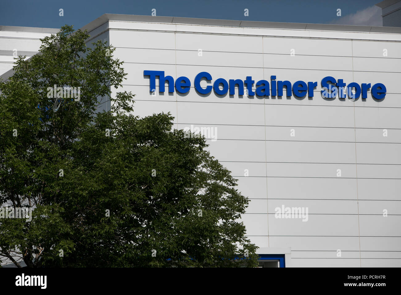 A logo sign outside of a The Container Store retail store in Broomfield
