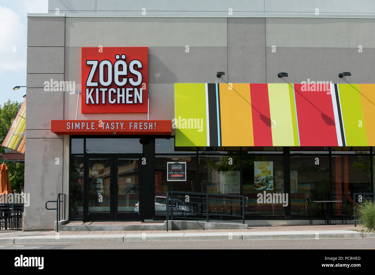 A logo sign outside of a Zoës Kitchen fast casual restaurant in Broomfield, Colorado, on July 23, 2018. Stock Photo