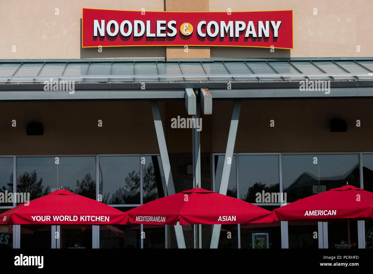 A logo sign outside of a Noodles & Company fast casual restaurant