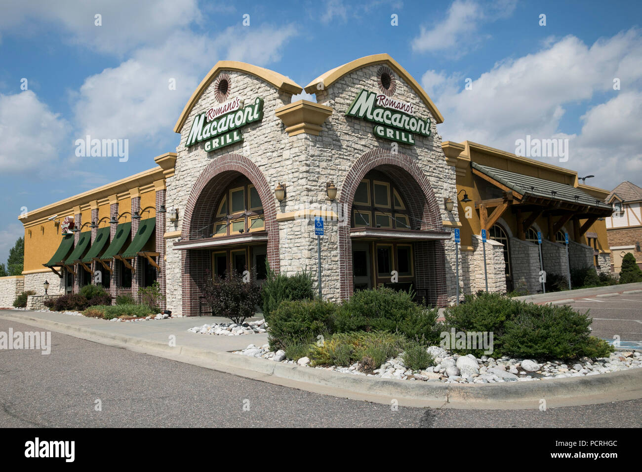 A logo sign outside of a Romano s Macaroni Grill restaurant