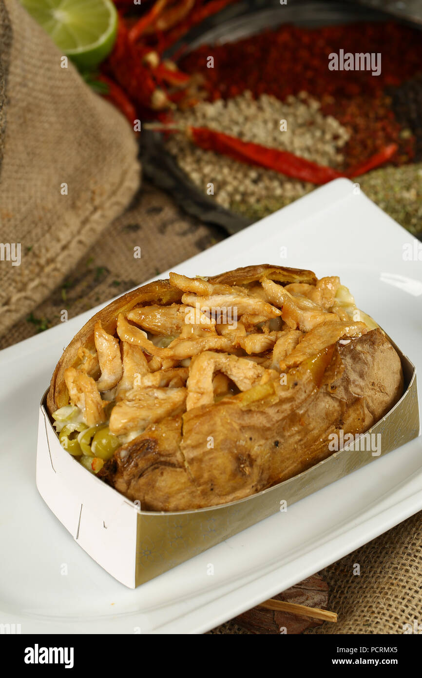 Kumpir / Turkish Baked potato with chicken meat Stock Photo
