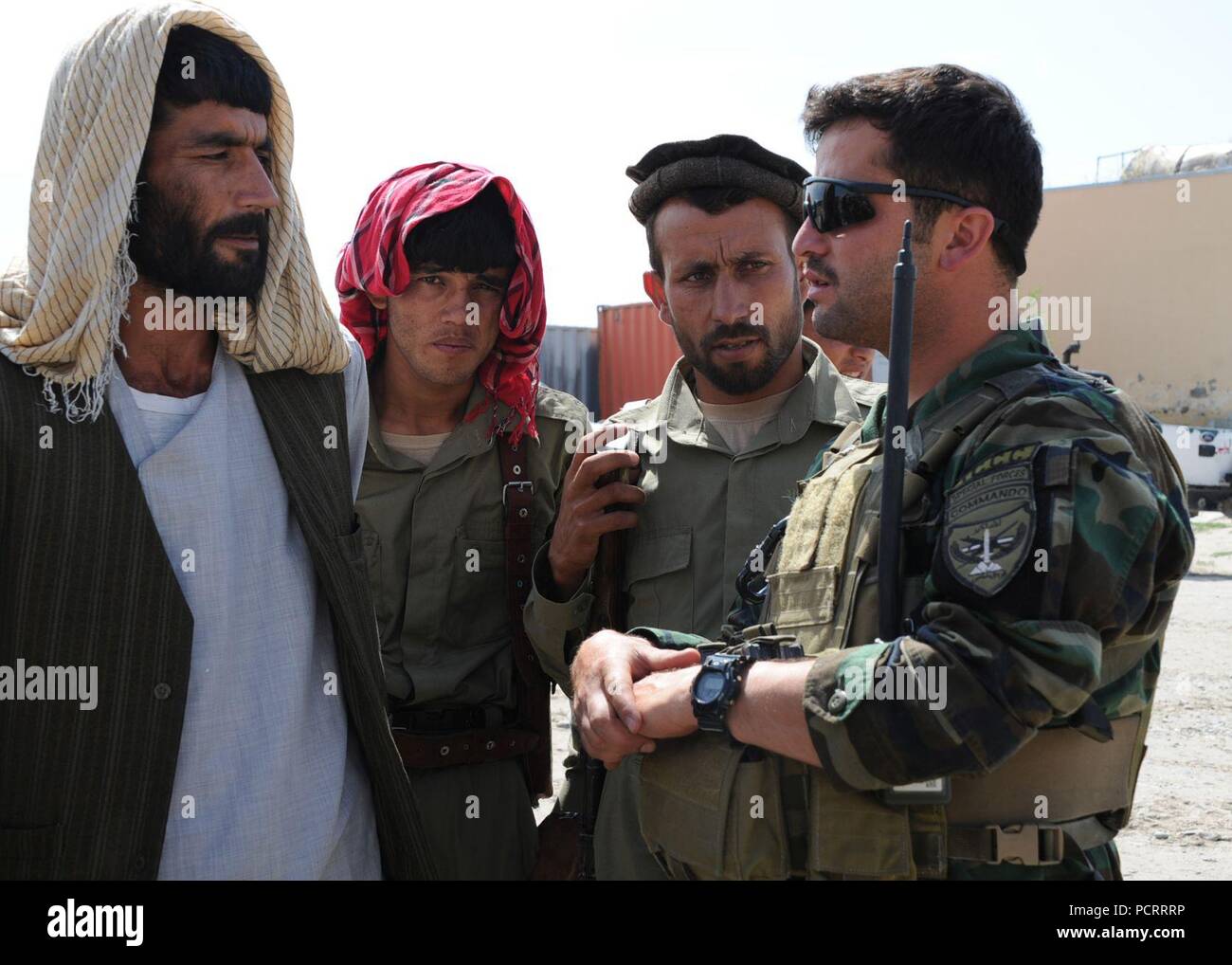 KUNDUZ PROVINCE, Afghanistan (May. 31, 2012) An Afghan National Army Special Forces instructor gives parting advice to new graduates of the Afghan Local Police Advanced Training Course in Kunduz province. The Ministry of the Interior sponsored the advanced training course, taught by the ANASF, to help legitimize the ALP and strengthen ongoing village stability operations in the region. Stock Photo