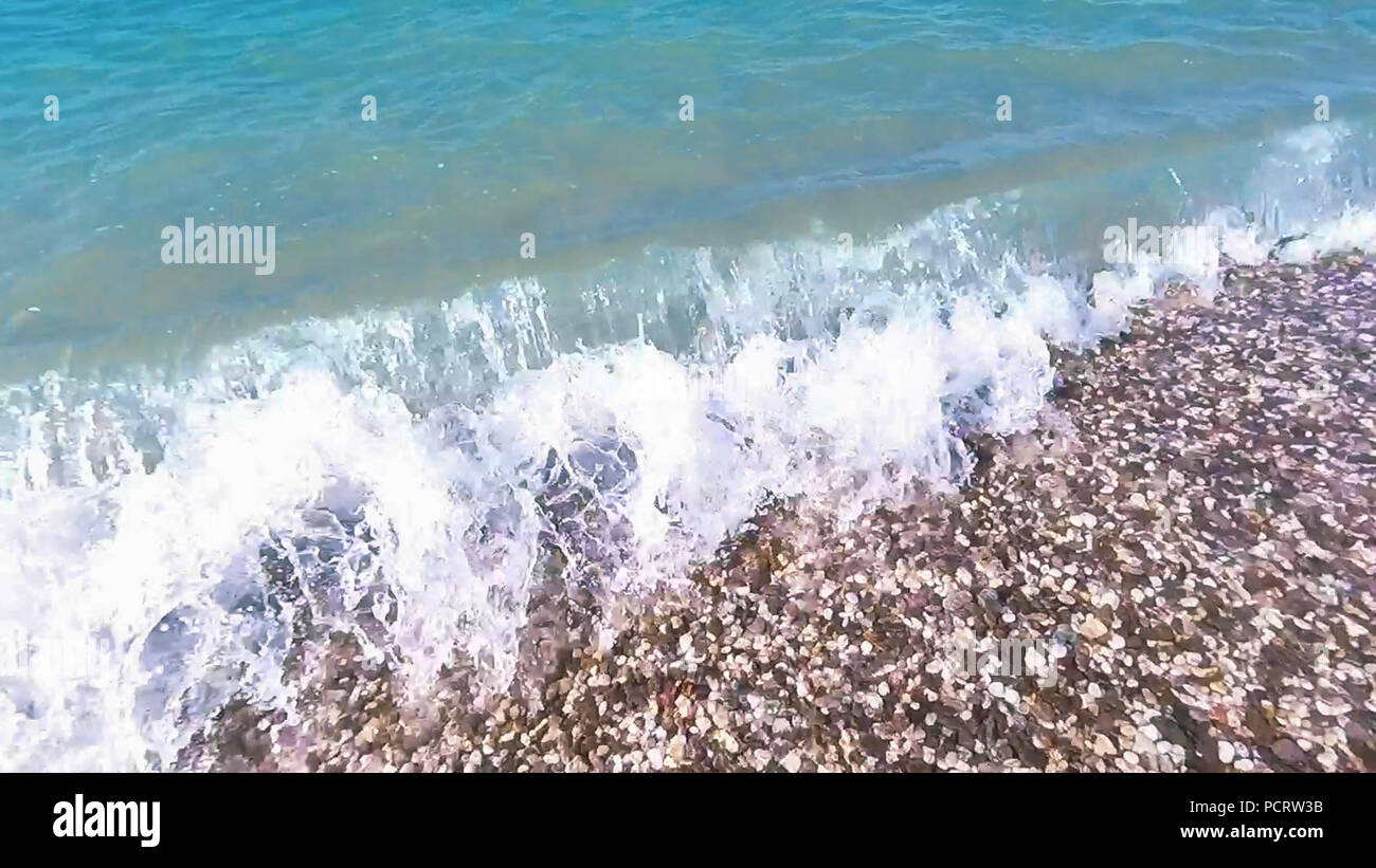 Pibble Wave The wave on the pebble beach in the summer Stock Photo - Alamy
