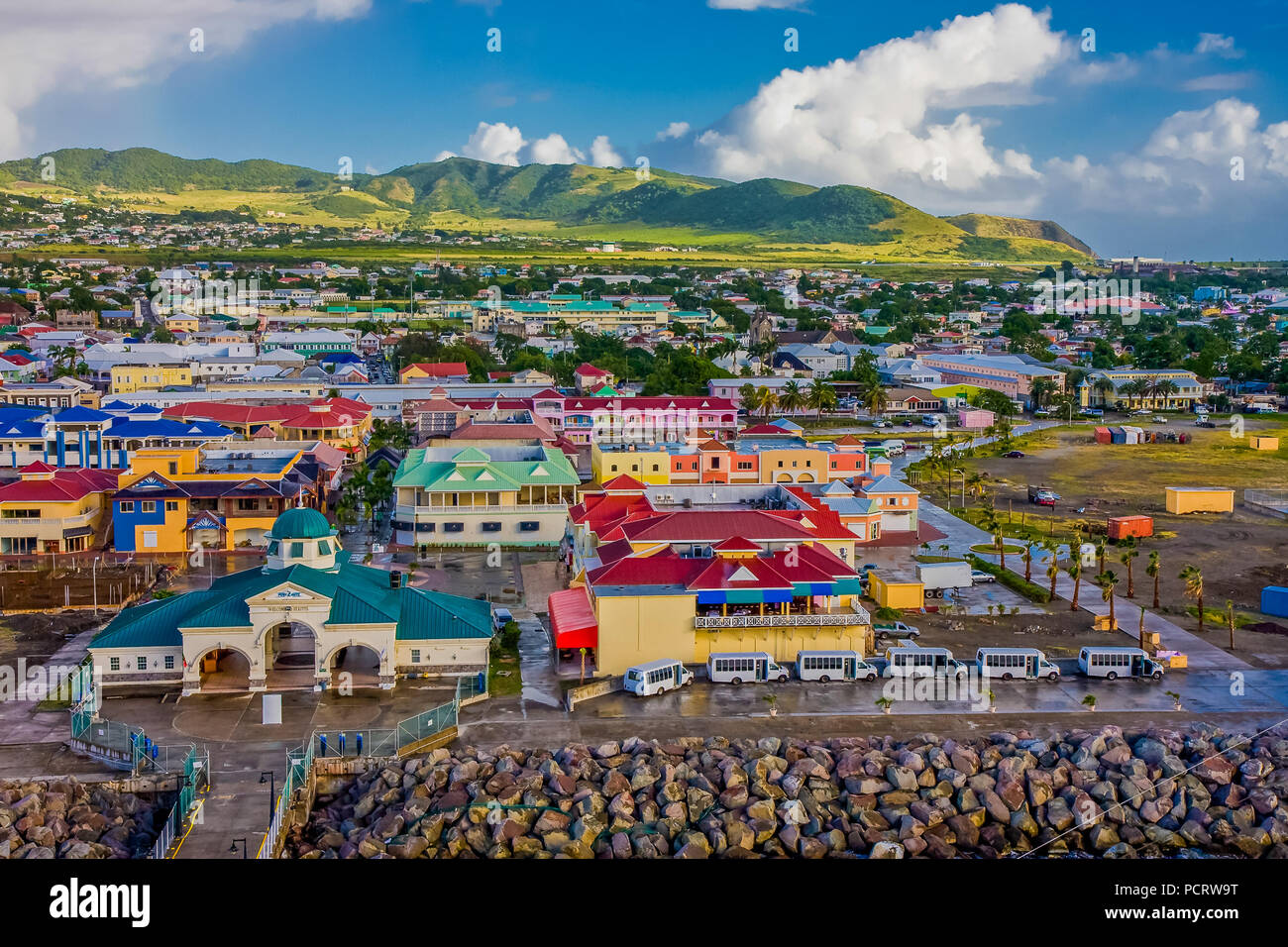 Colorful Town and Green Hills Stock Photo