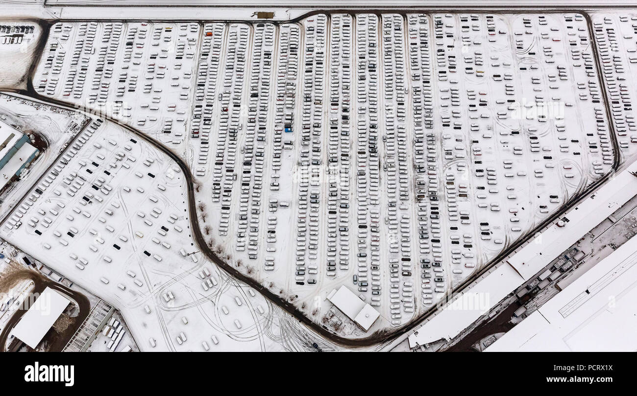 Aerial view, Helf Automobil-Logistik GmbH, Katernberg, car parking spaces, new car interim storage, car heap, new vehicles in the snow, Essen, Ruhr area, North Rhine-Westphalia, Germany, Europe Stock Photo