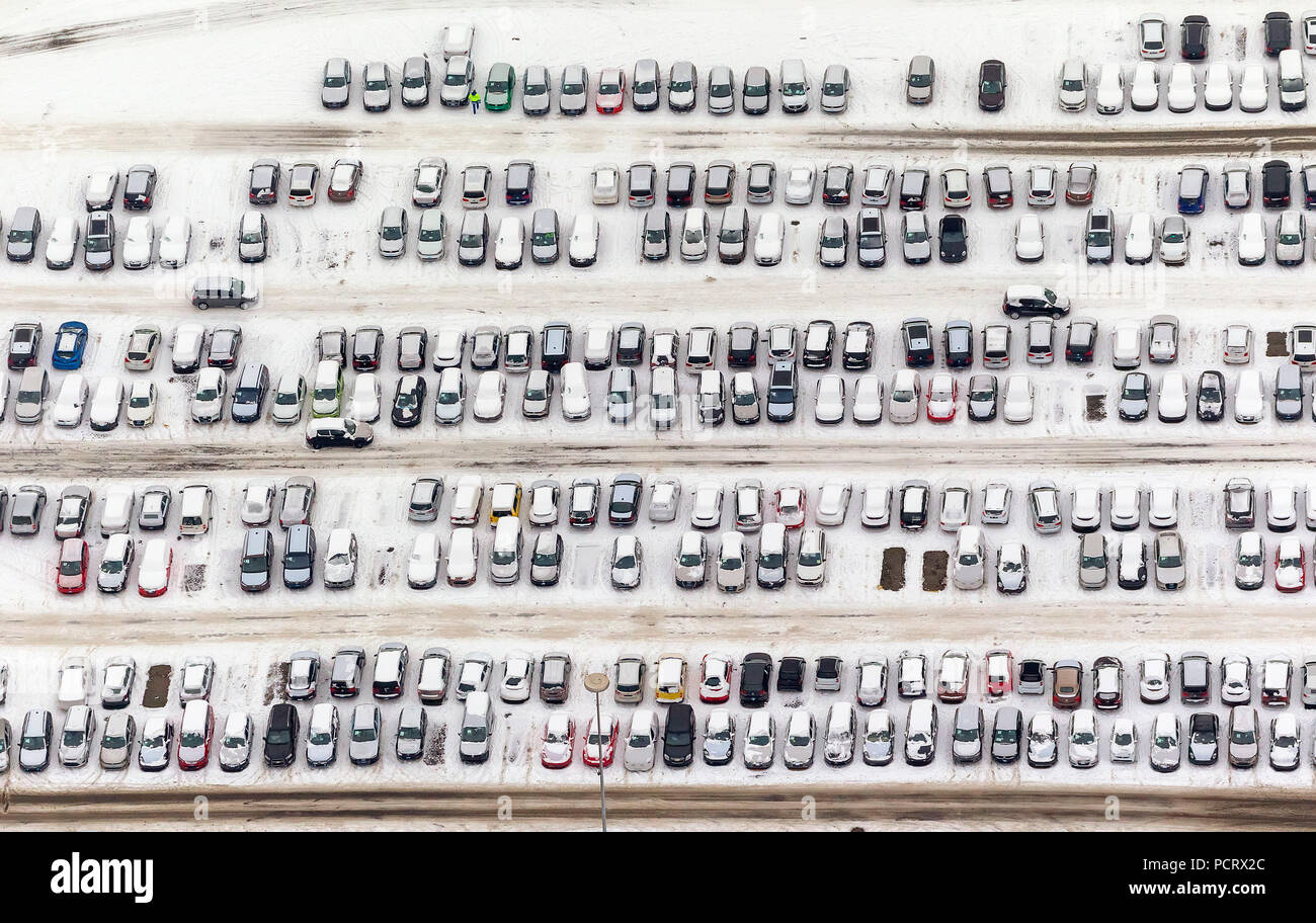Aerial view, Helf Automobil-Logistik GmbH, Katernberg, car parking spaces, new car interim storage, car heap, new vehicles in the snow, Essen, Ruhr area, North Rhine-Westphalia, Germany, Europe Stock Photo
