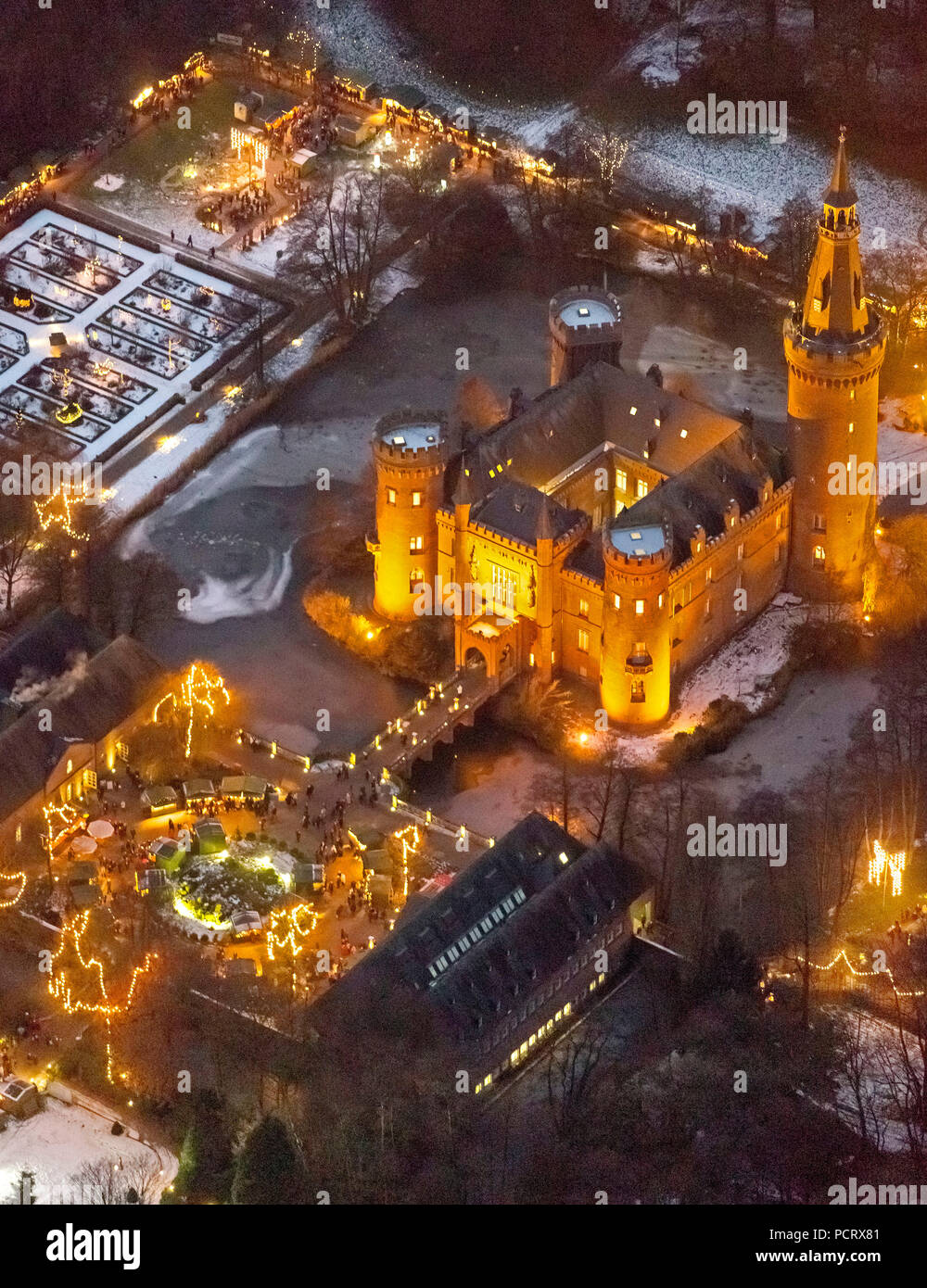 Aerial view, Bedburg-Hau, Lower Rhine, Moyland castle, Christmas market, night photography, blue hour, handcraft Christmas market, North Rhine-Westphalia, Germany, Europe Stock Photo