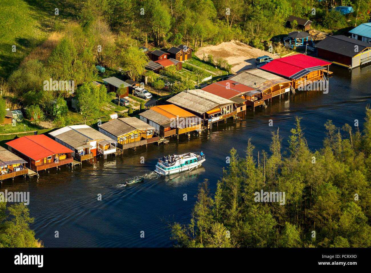 Boathouses on Mirowsee and canal passage to Zotzensee, Mirow, Mecklenburg Lake District, Mecklenburg Lake District, Mecklenburg-Western Pomerania, Germany Stock Photo