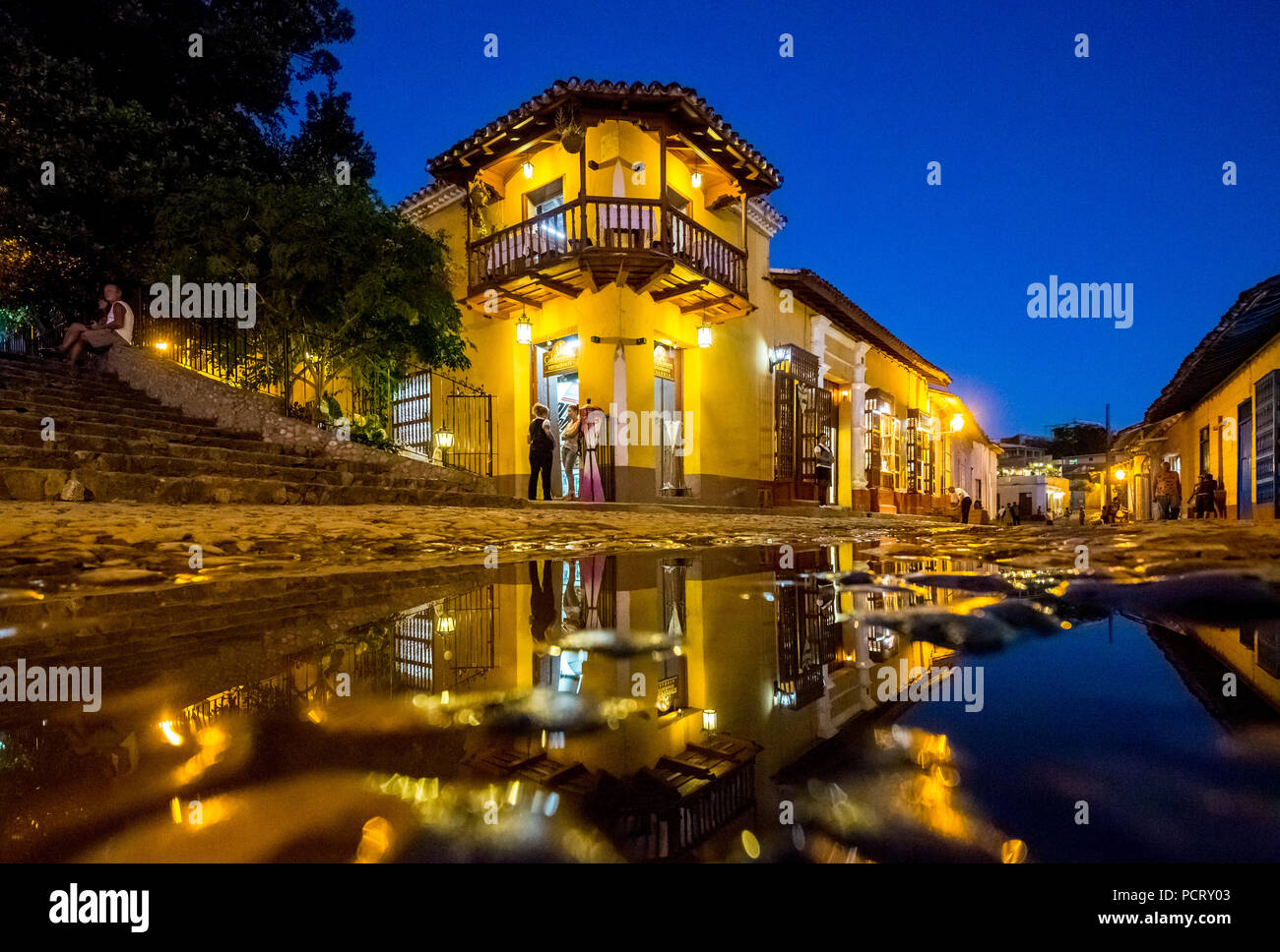 Restaurant and public house in the historic city centre of Trinidad with visitors during the Blue Hour, Trinidad, Cuba, Sancti Spíritus, Cuba Stock Photo