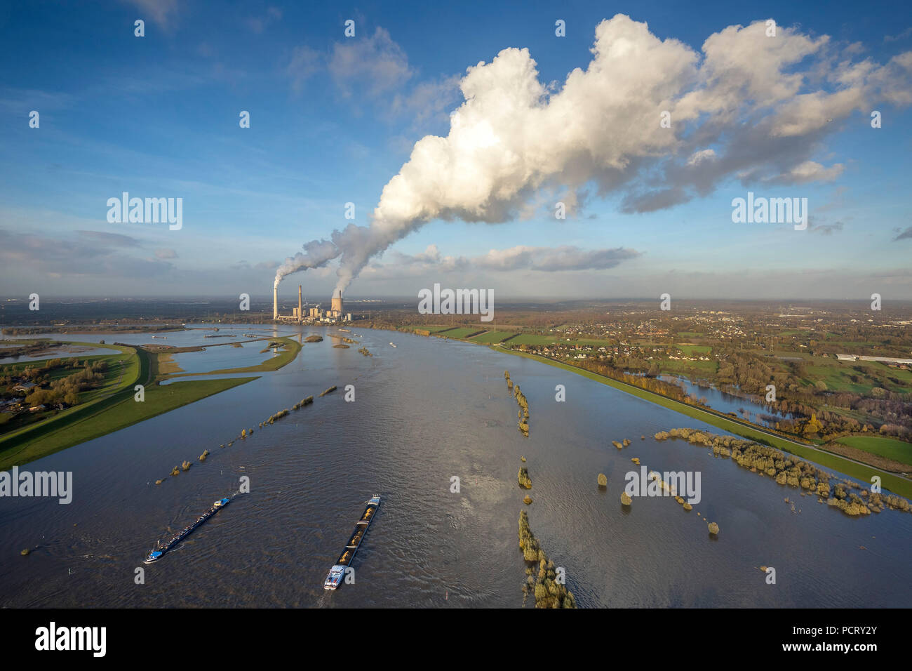 View over the Rhine near Dinslaken, autumn flood, inland shipping, power plant Voerde, chimneys with smoke column, Dinslaken, Ruhr area Stock Photo