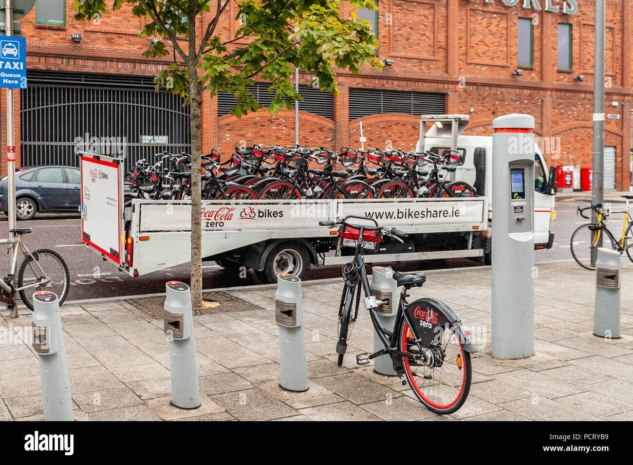 Coca Cola Bike Share bicycles on the back of a truck ready for servicing in Cork City Centre, Ireland. Stock Photo