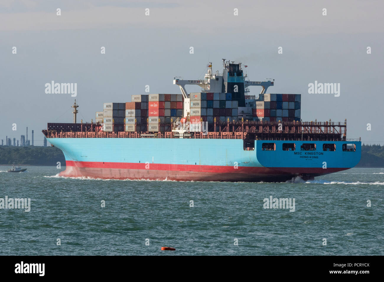 large container ship entering the port of Southampton docks in the ...