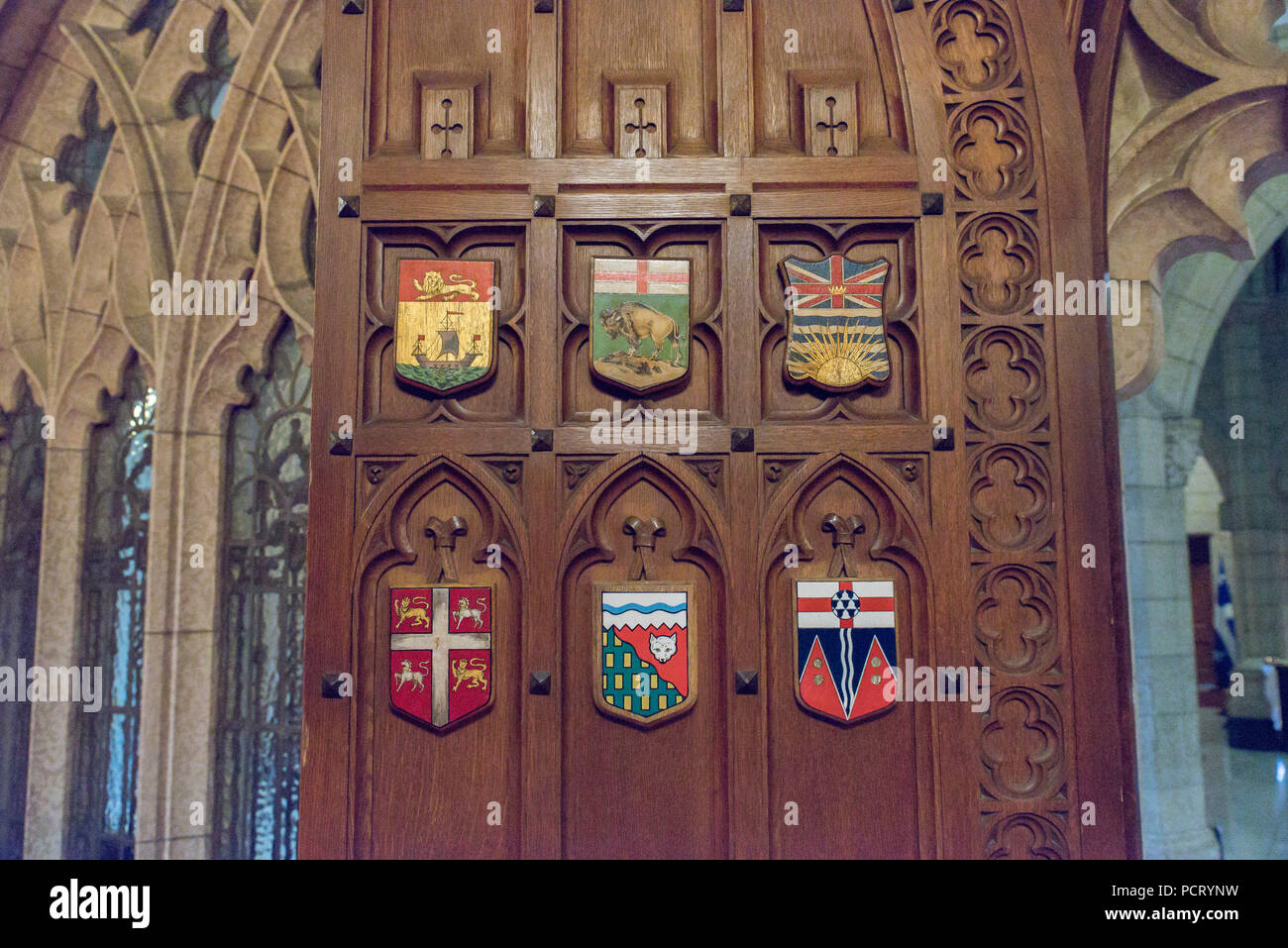 Ottawa, Ontario, Canada.  Senate Chamber east door with provincial shields in Centre Block building on Parliament Hill. Stock Photo