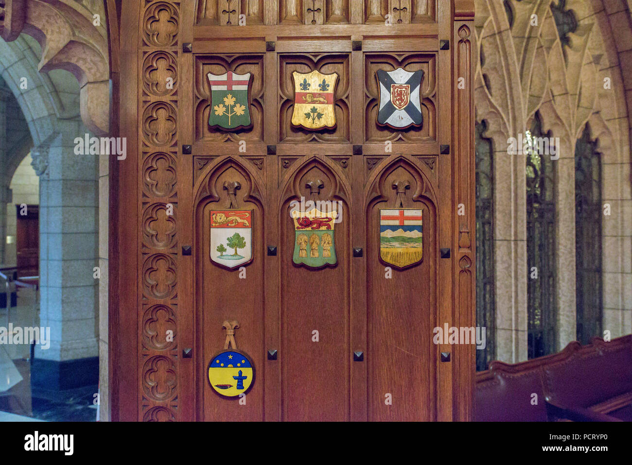 Ottawa, Ontario, Canada.  Senate Chamber west door with provincial shields in Centre Block building on Parliament Hill. Stock Photo
