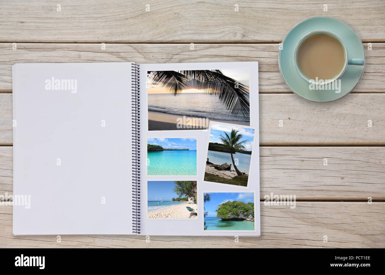 Photobook Album on Deck Table with Travel Photos of beaches and Coffee or Tea in Cup Stock Photo