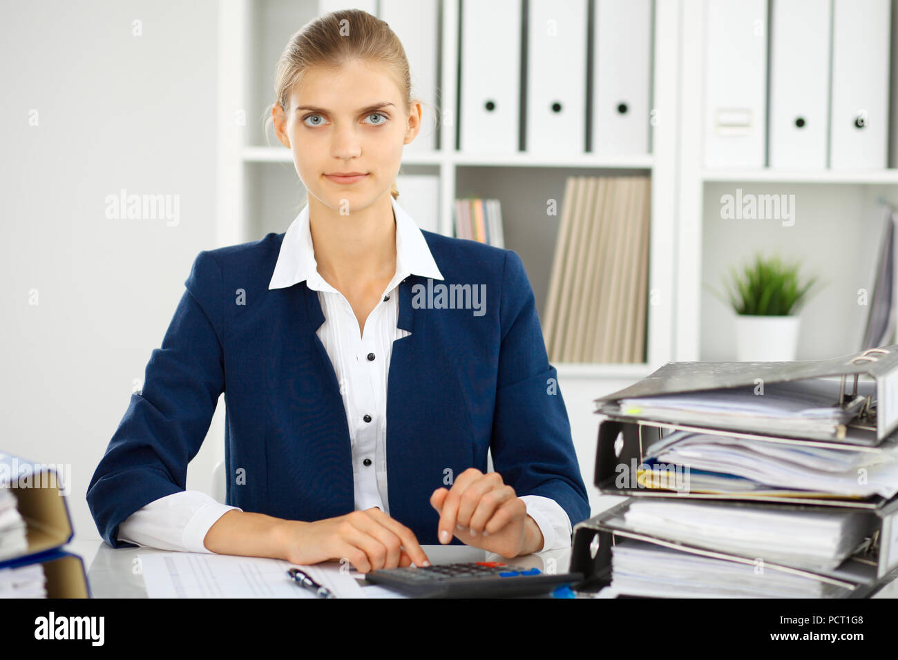 Modern business woman or confident female accountant in office. Student ...