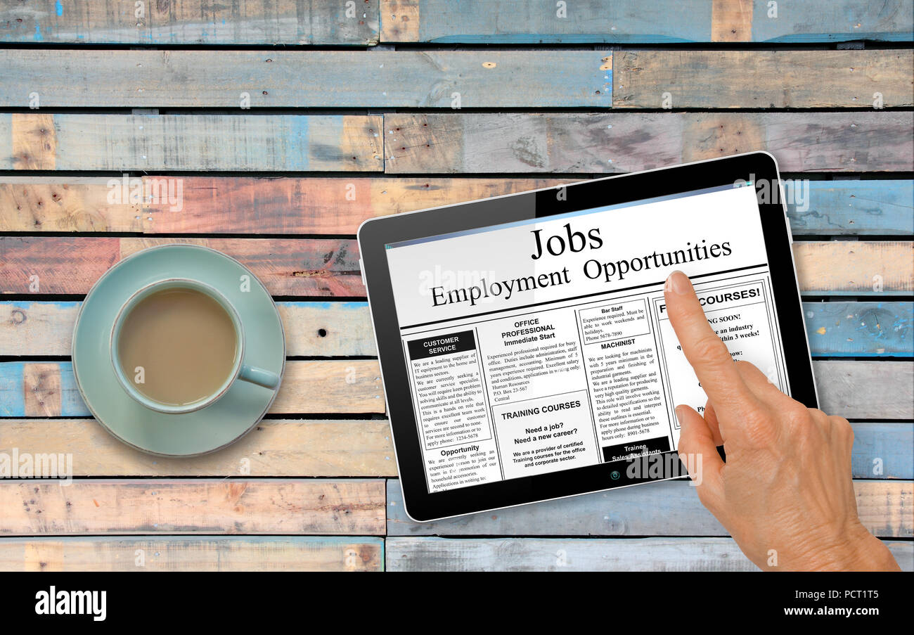 Online job hunting Hand with computer tablet reading employment 