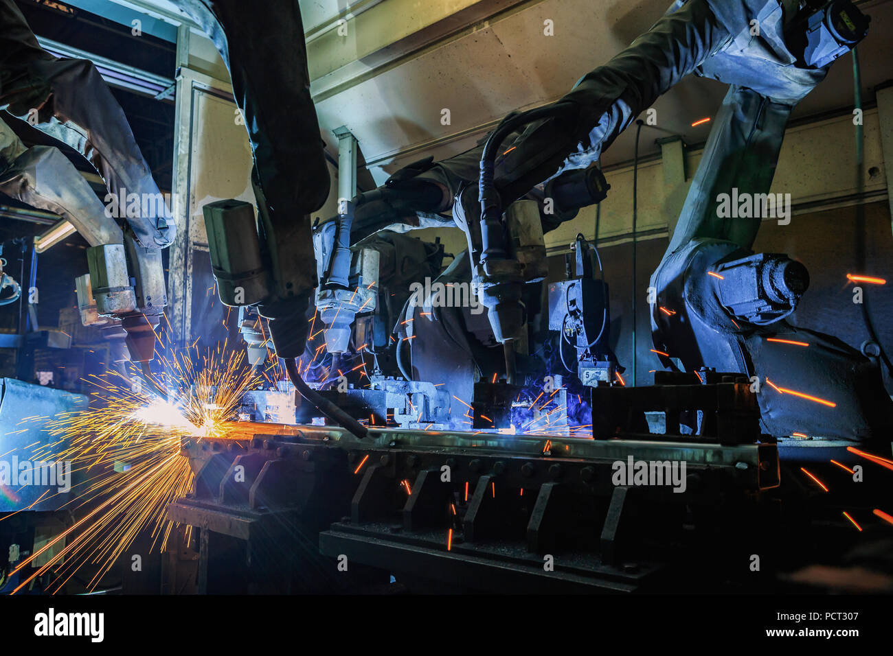 Robot are welding metal part Stock Photo