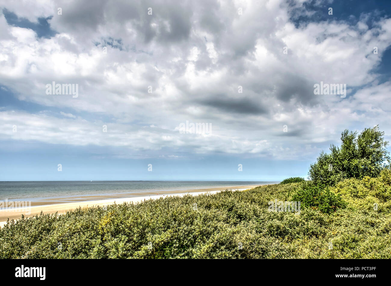 Spectacular cloud formations over the Northsea beach and adjacent dunes near Rockanje, The Netherlands Stock Photo