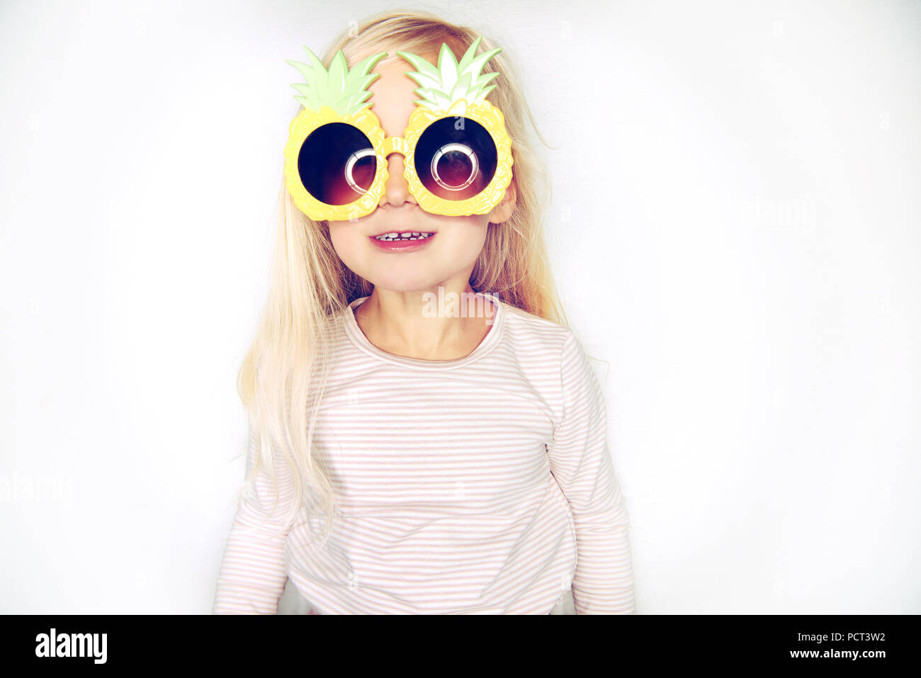 Cute Little Girl With Long Blonde Hair Wearing Funny Pineapple