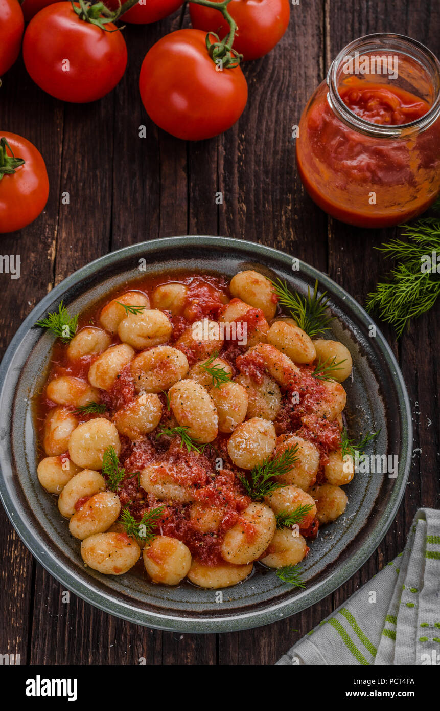 Gnocchi tomato sauce herbs, fresh parmesan cheese top, delish food Stock Photo