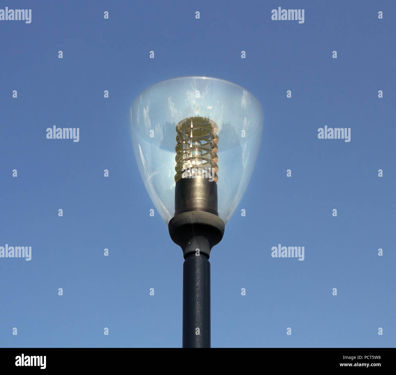 Lamp pole over the blue sky photo Stock Photo