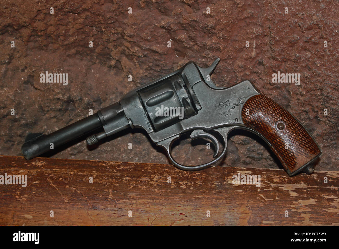 Vintage revolver on the coarse background photo Stock Photo